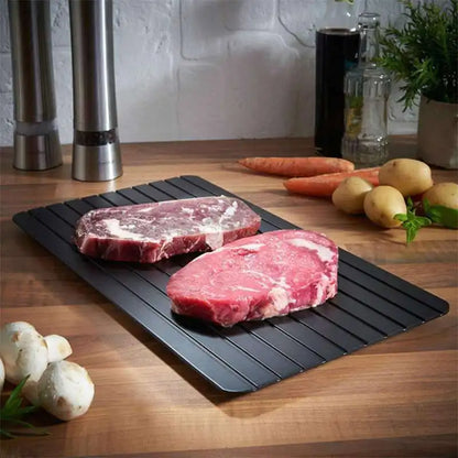 steak pieces on the rapid meat defrosting tray
