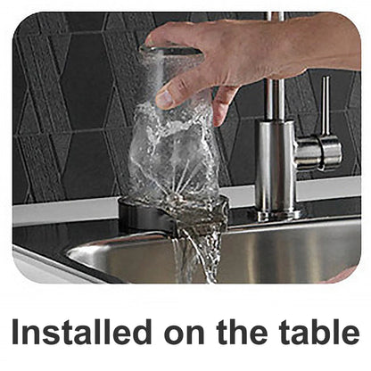 Hand holding a clear container under a faucet with water flowing, installed on a table.